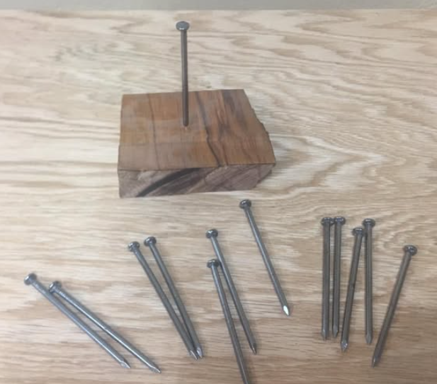 The 12 nails on 1 nail puzzle setup